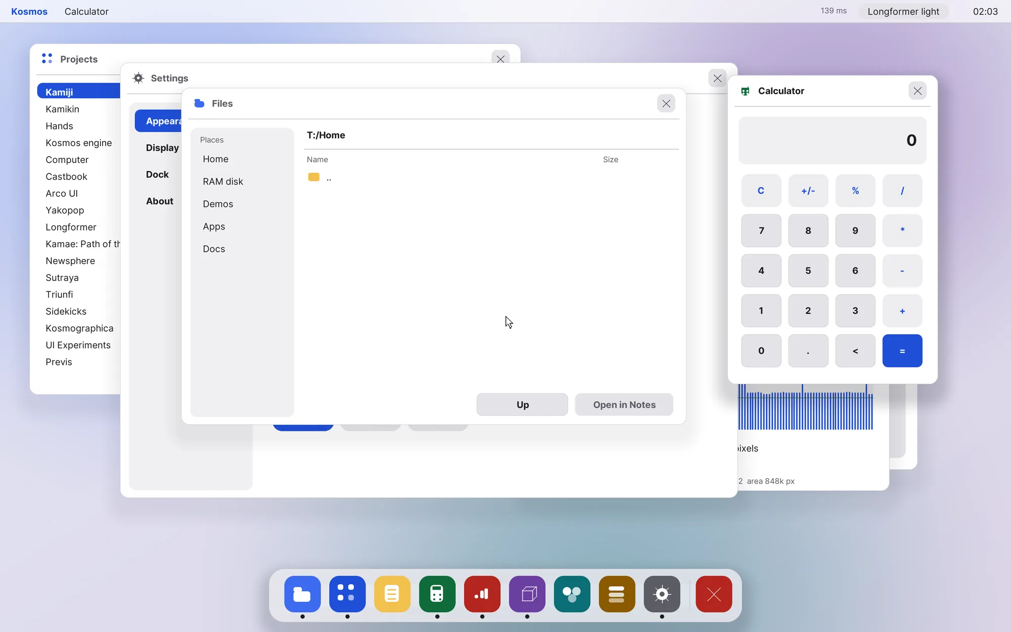 The desktop in light mode, with Settings, Files and Calculator open